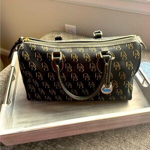 Authentic Dooney and Bourke black handbag monogrammed. In pristine condition.